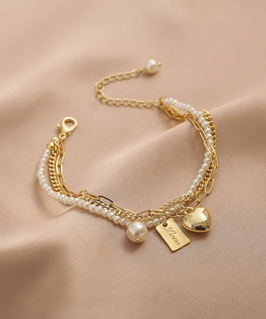 Gold Metal Alloy Pearl Graphic Love Tassel Charm Bracelet